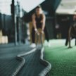 Two women in a gym doing pushups