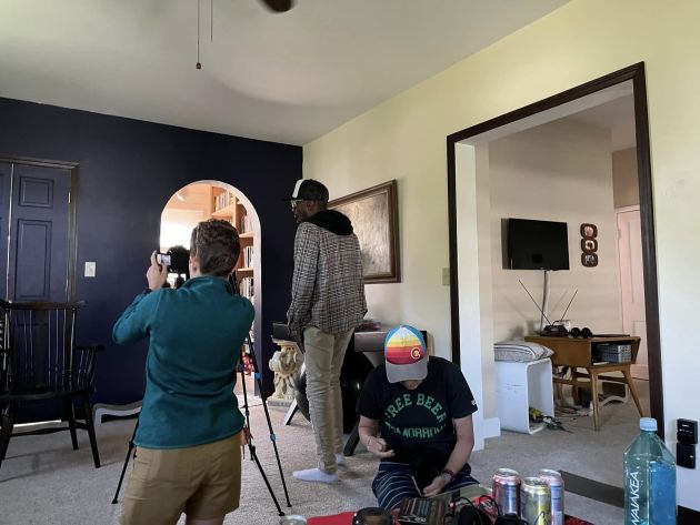 Camera crew setting up materials for an interview.