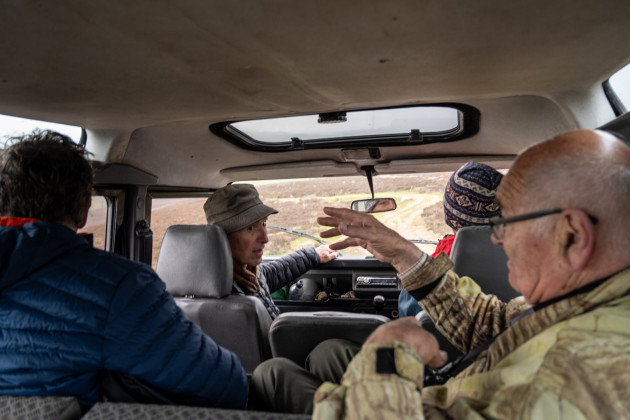Four people in Land Rover driving through the countryside