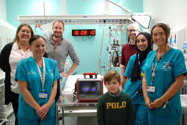 This photo shows a child's transport ventilator at Croydon Hospital's A&E Department and staff as well as Mason, the face of the Little Breaths appeal