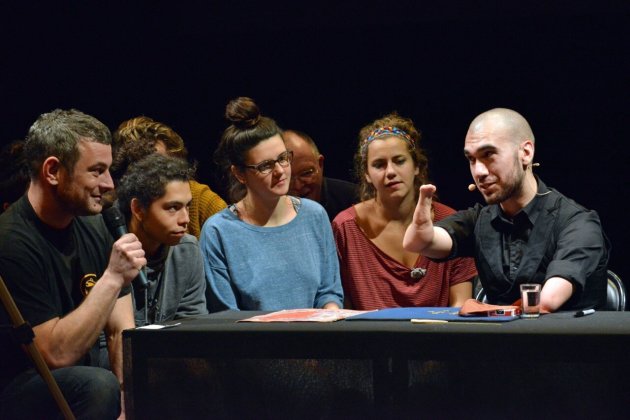 Mahdi The Magician performing a magic trick with the audience seated surrounding him
