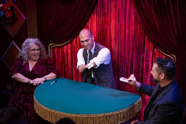 The audience reacting to Mahdi The Magician performing close-up card magic